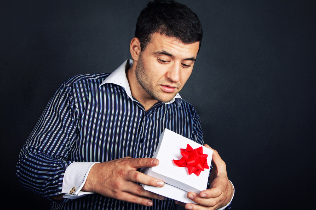 A man is opening a gift box